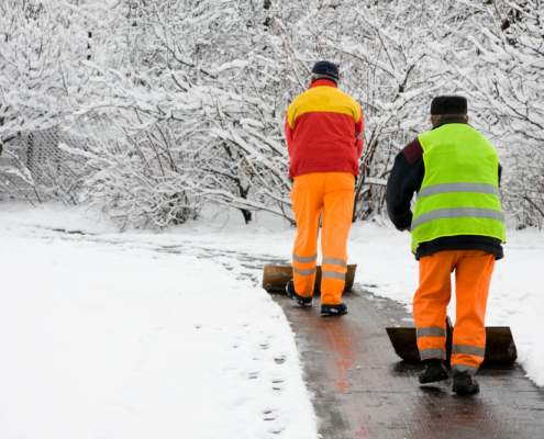 Workers removing first snow